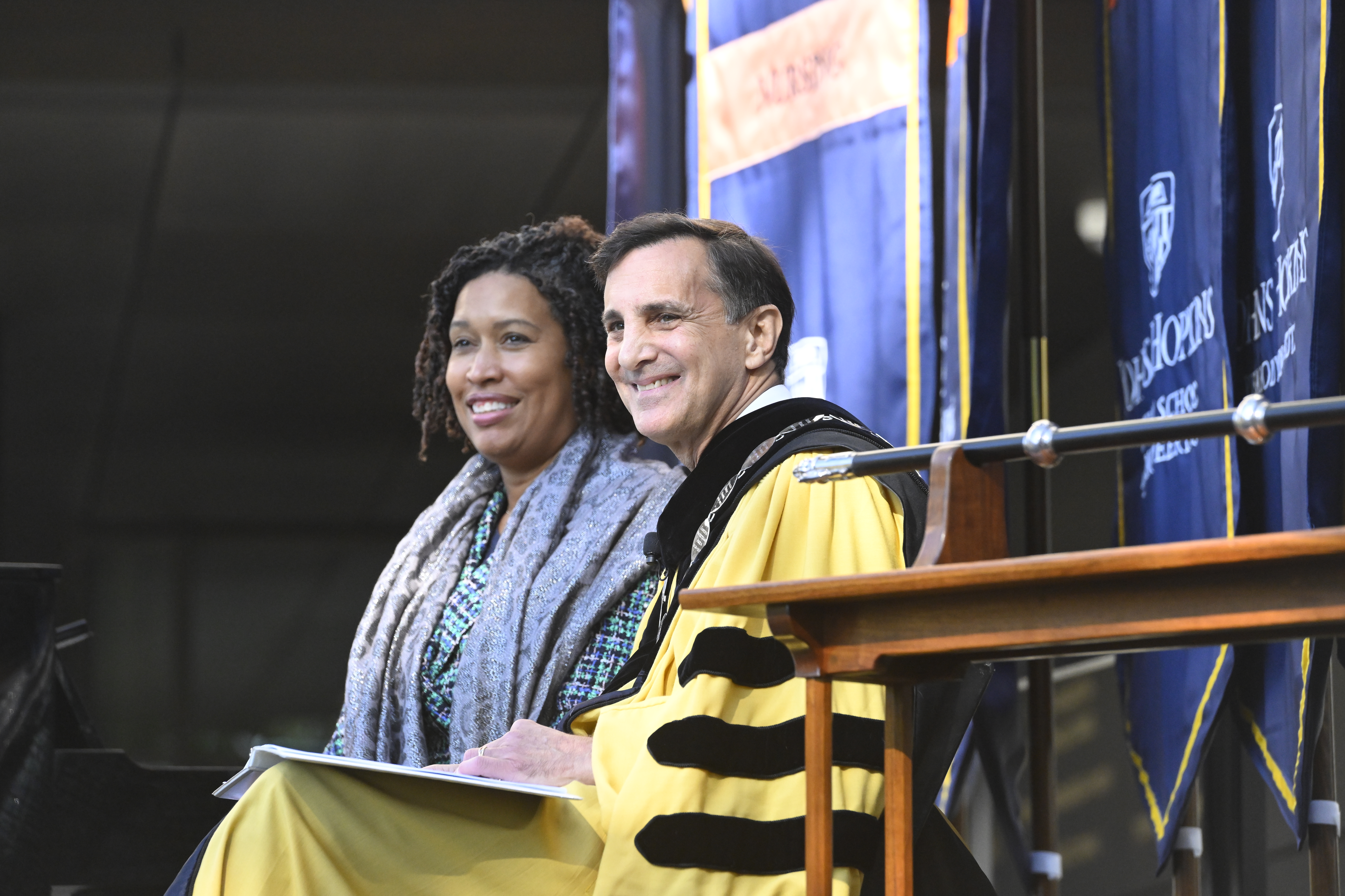 JHU President Ron Daniels and Washington DC Mayor Muriel Bowser smile while sitting next to each other
