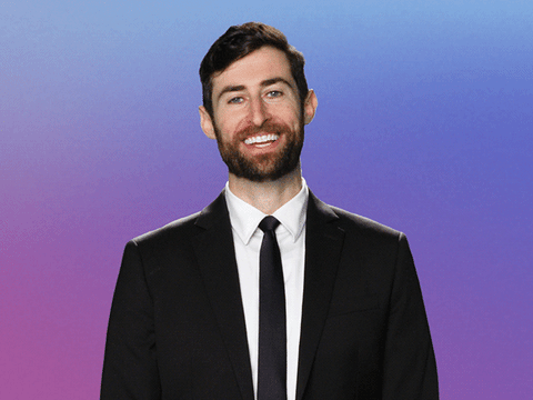 Animated gif shows Scott Rogowsky laughing, then stopping abruptly