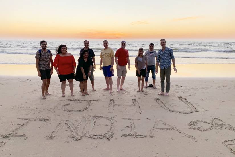 A group of people on a beach with 