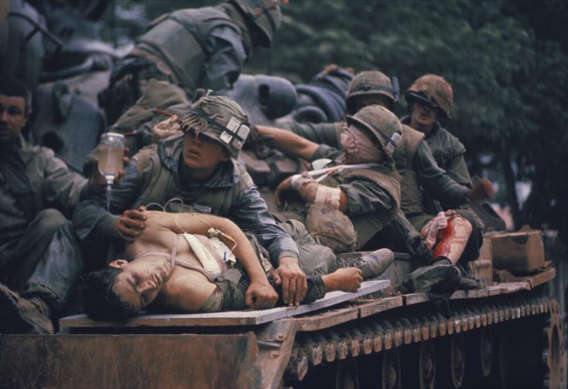 *Stars and Stripes photographer* John Olson captured this image with A.B. Grantham in the foreground. The photograph became known as The Marine on The Tank during the Battle of Hue. The picture ran in *Life* magazine and other publications around the world. 