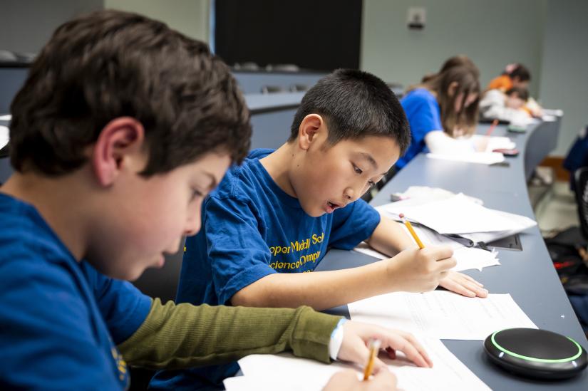 Middle schoolers work during the Maryland Science Olympiad