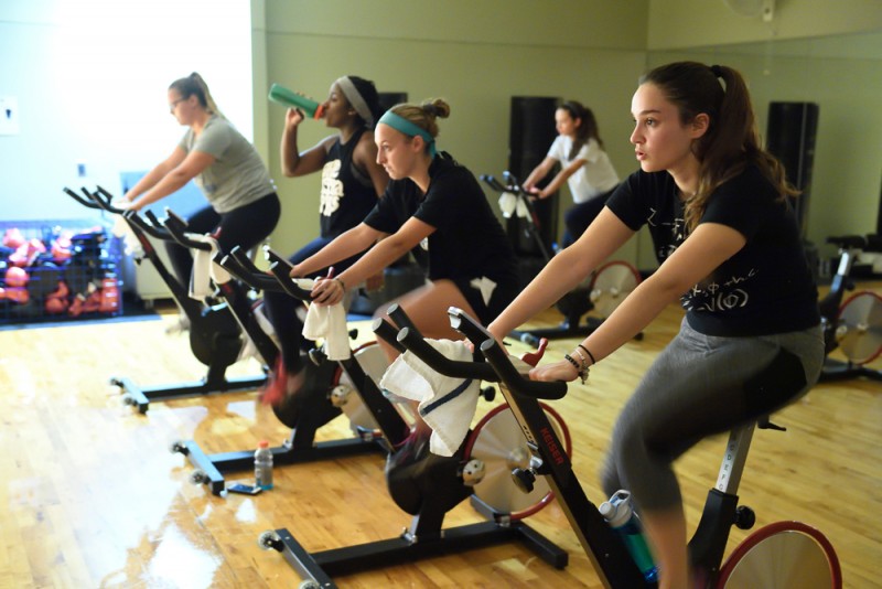 A group of women on spin bikes 
