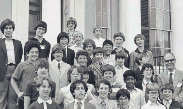 A black and white photo of a group of students on steps