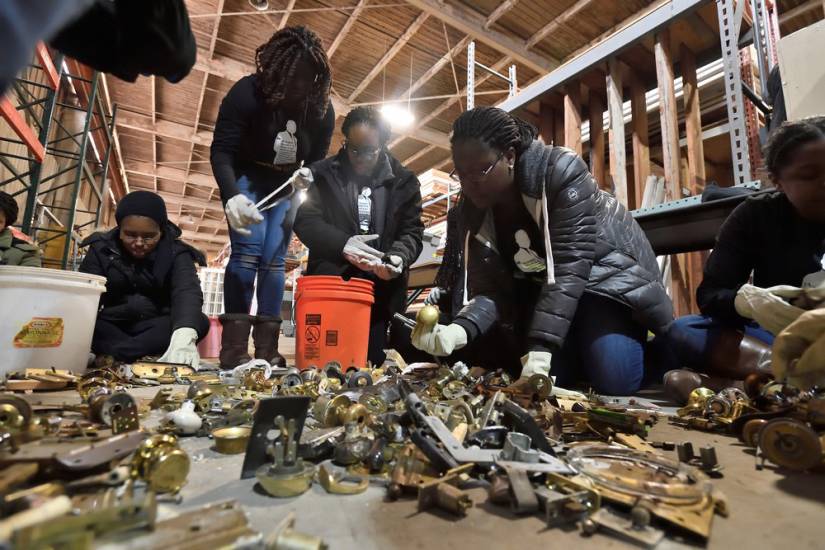 Students sort and organize scrap material at Second Chance Baltimore