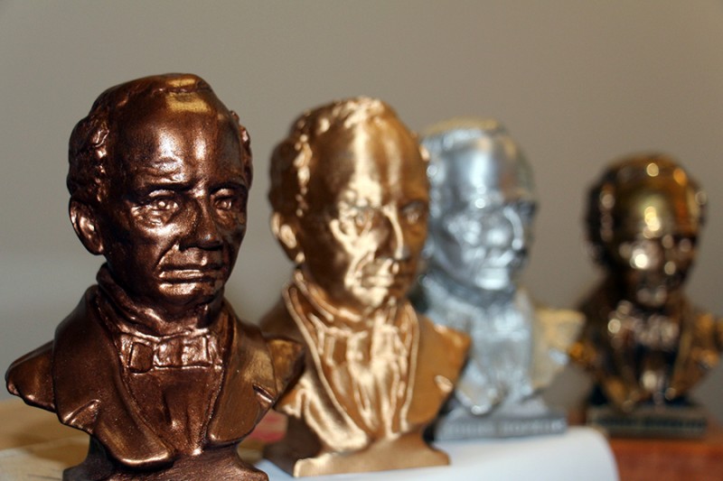 A closeup photo of a small bronze bust