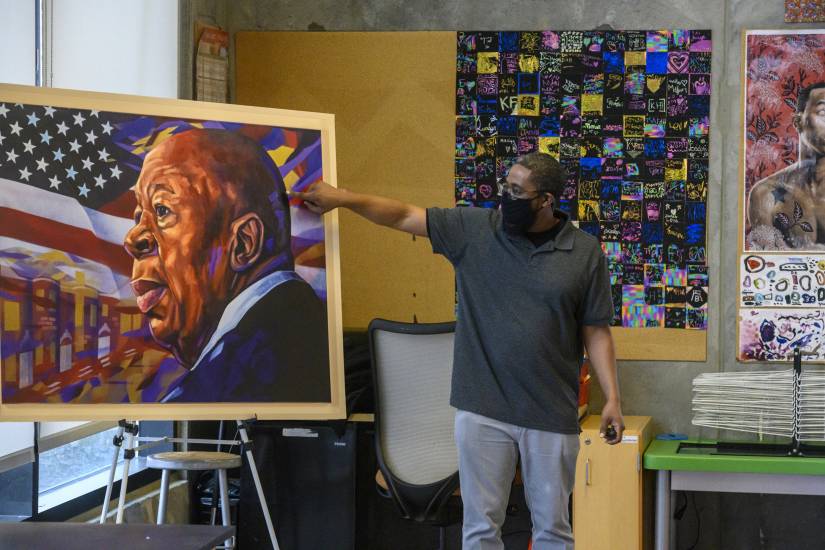 Artist Christopher Batten leads a portraiture workshop with Henderson-Hopkins students after his painting of Elijah Cummings was unveiled at their school Jan. 20