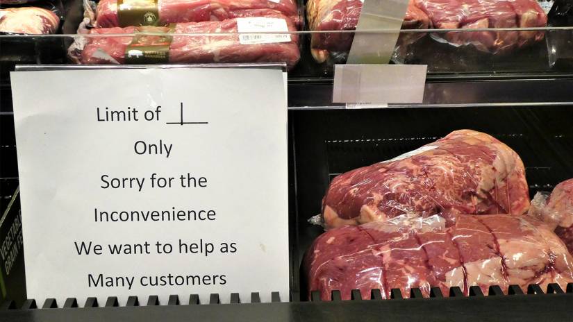Sign in a supermarket meat display reads 