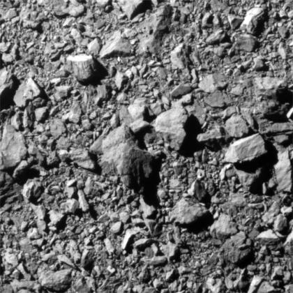 The gray, rocky surface of an asteroid