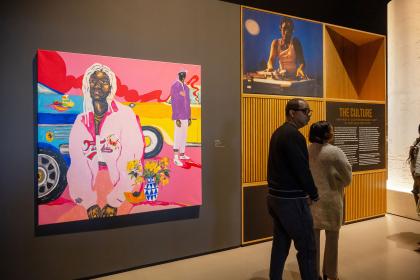 A photo from the opening night of the BMA's 'The Culture' exhibit shows museumgoers standing in front of paintings