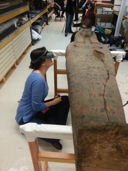 Kara Cooney looks at a coffin