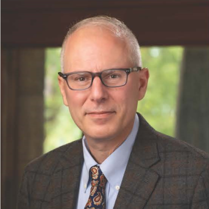 Photograph of Scott Miller, a white man in professional dress