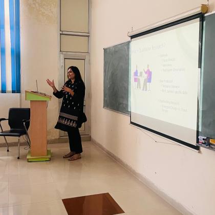 Baldeep giving a lecture at Panjab University on Qualitative Research
