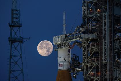 Image of a rocket with the moon in the background