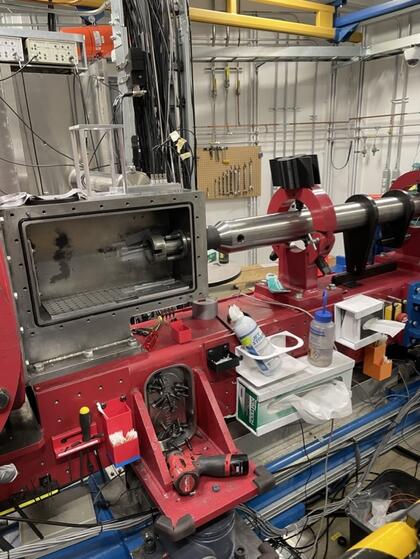 A machine that tests how granular materials respond to extreme impact sits in a lab.