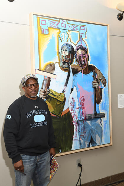 Ernest Shaw Jr. with his painting 