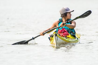 Closeup of Maya Dizack paddling the Mississippi River