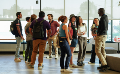 Photograph of a diverse group of people networking