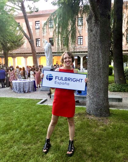 Rhiannon Clarke holds up a sign that reads 