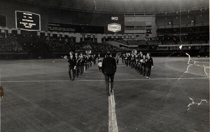 The Johns Hopkins Pep Band marching in perfect H formation on the field at the Houston Astrodome before the big Hopkins-Navy lacrosse game in 1971. Photo courtesy of Irv Litofsky, A&S '73.