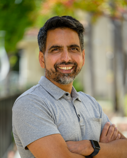 A professional headshot of Sal Khan