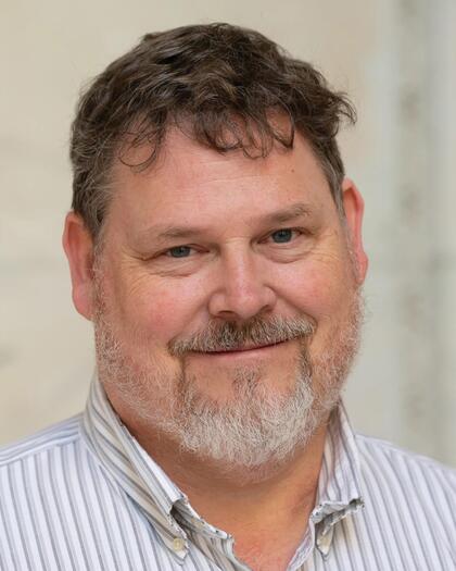 Professional headshot of David DeMille