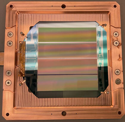 Four silicon CCD skippers surrounded by copper