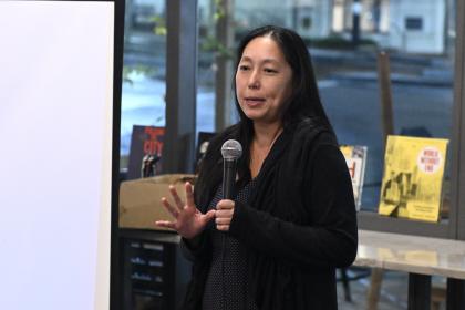 Janice Chen speaks into a microphone.