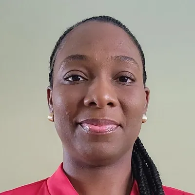 A professional headshot of Ama Apenteng