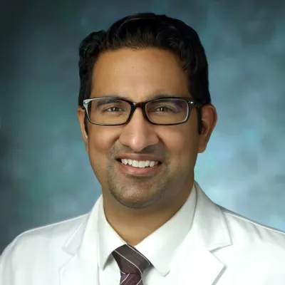 A professional headshot of Debraj Mekherjee