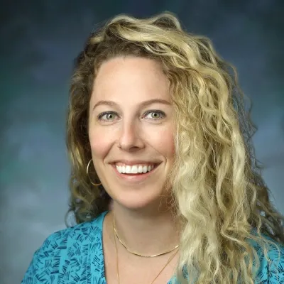 A professional headshot of Kayla Otto