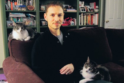 Science writer David Grimm with his pet cats, Jasper and Jezebel