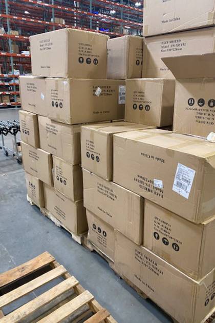 Boxes of face masks and shields