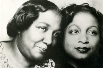 Two African-American women post for picture or Two African-American women post for picture or