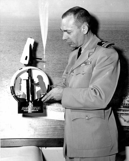 Navy captain shows a model