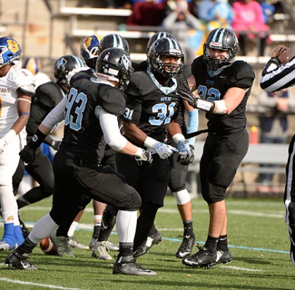 JHU players celebrate after a turnover