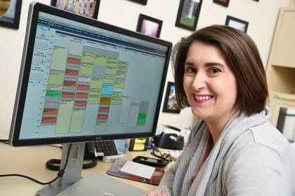 Chelsea Buyalos looks at the performance calendar on her monitor