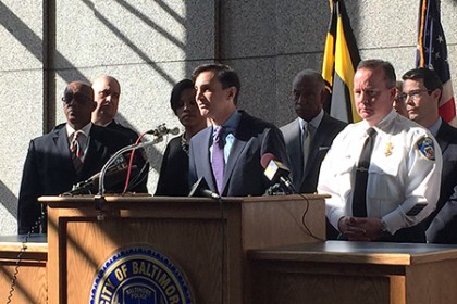 JHU President Ron Daniels speaks at podium