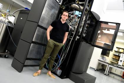 Ed Twomey stands in front of the Titan Krios microscope