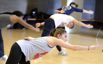 Students stretching before hip-hop class