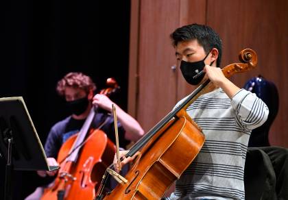 HSO string players practice while wearing masks
