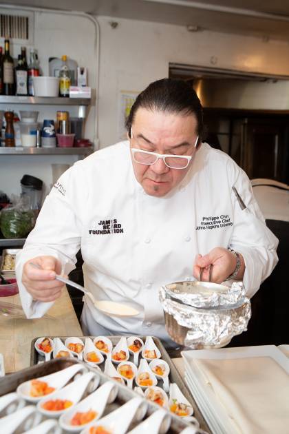 Chef Chin plates an hors d'oeuvre
