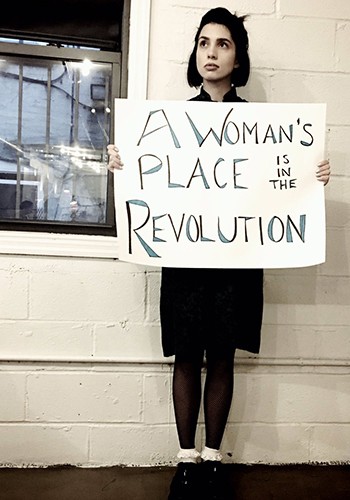 Nadya Tolokonnikova holds a sign reading 