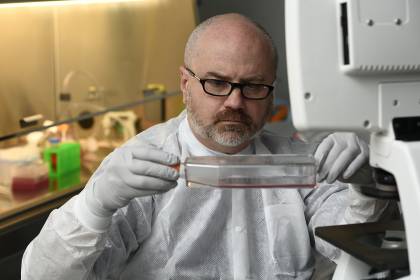 Andy Pekosz prepares bio material for testing