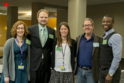 Five people pose at the Johns Hopkins Postdoctoral Retreat