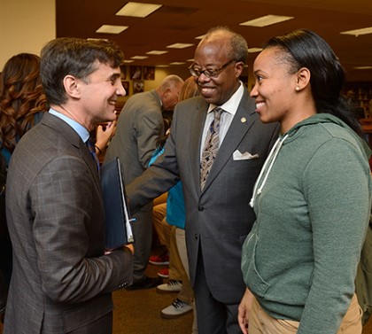 JHU President Ron Daniels speaks with a high school student