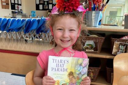 Young girl holding book