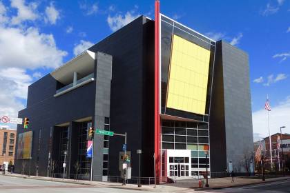 Exterior of modern building with yellow, red facade accents