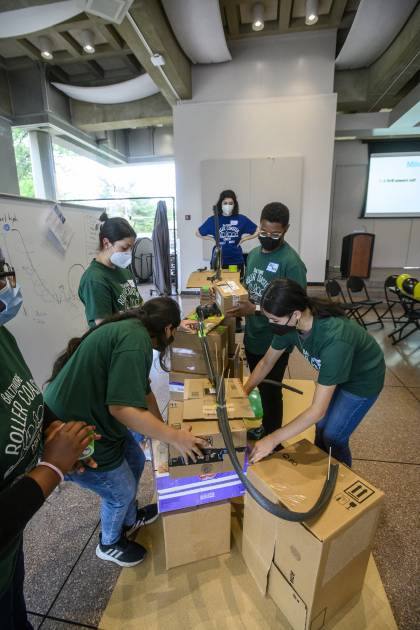 A team of students construct a roller coaster