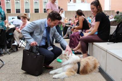 Kevin Shollenberger pets a dog