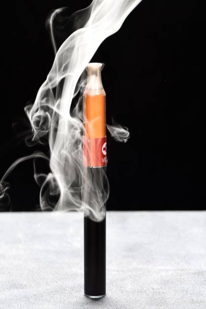 An e-cigarette and smoke